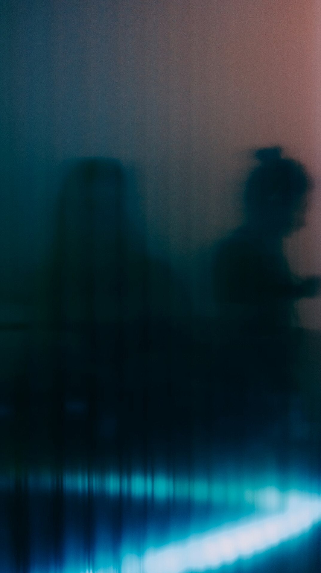Blurred silhouettes of a crowd at a distance